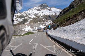 Riding through Alps by motorcycle, approaching Belvédère Rhonegletscher 