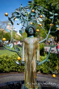 Figure of woman with orange tree in Tivoli Gardens of Copenhagen